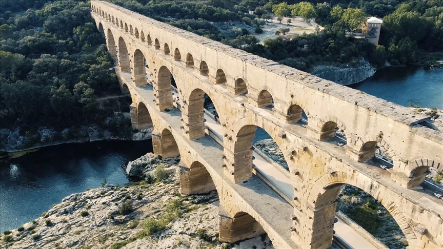 The Pont du Gard in southern France, ideally with the surrounding landscape visible to show the scale.